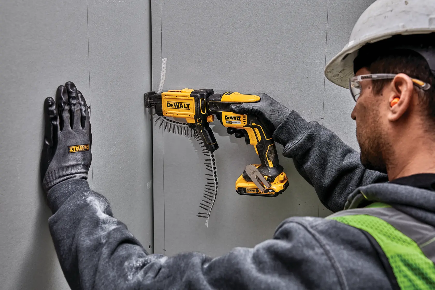 Side view of a DEWALT DCF6202 drywall screw gun attachment designed for use with power tools, featuring a yellow and black handle and casing.
